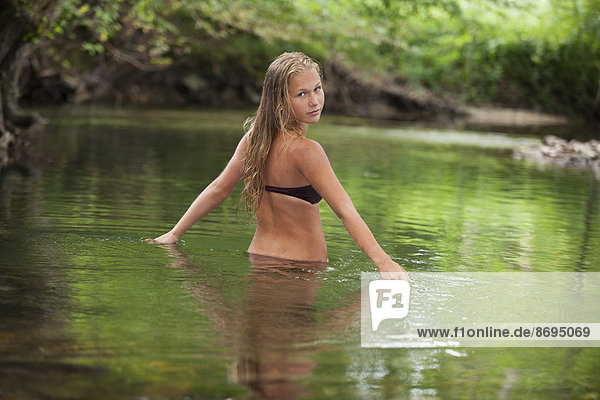 Austria  Salzkammergut  Mondsee  teenage bathing in a brook