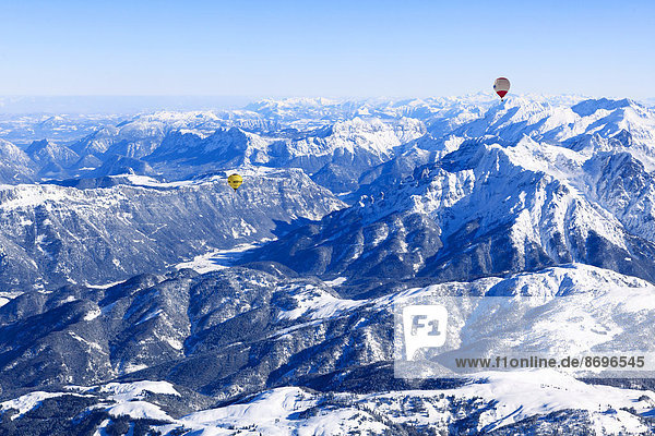 Hot air balloons flying over the Alps  Unterinntal  Tyrol  Austria