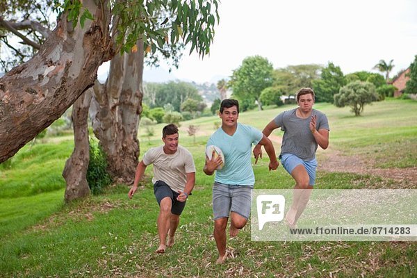 Boys playing touch rugby