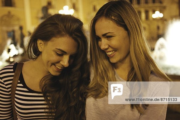 Two young women tourists  Plaza de la Virgen  Valencia  Spain