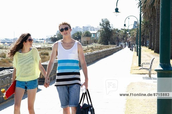 Young couple holding hands  Port Melbourne  Melbourne  Australia