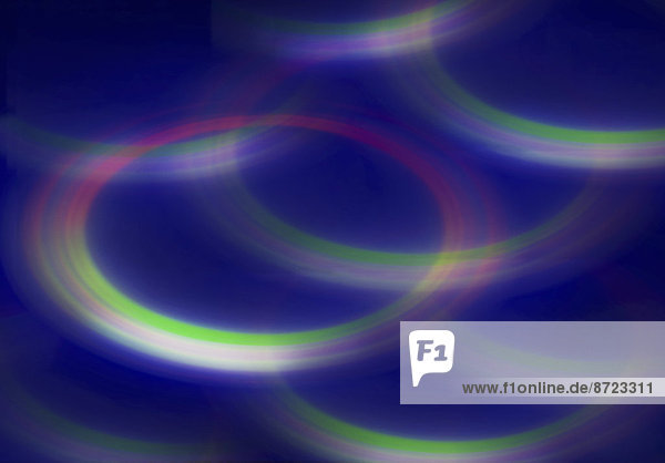 Verschwommenes fluoreszierendes  abstraktes Hintergrundmuster aus Kreisen