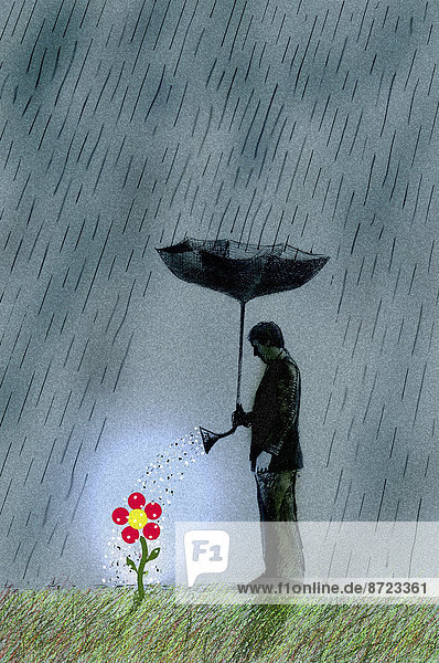 Geschäftsmann steht mit einem umgestülpten Regenschirm im Regen und gießt eine Blume