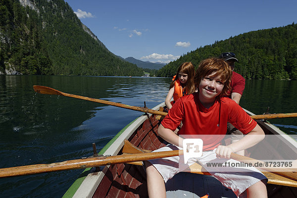 Children in a rowing boat on lake Königssee  Berchtesgadener Land district  Upper Bavaria  Bavaria  Germany