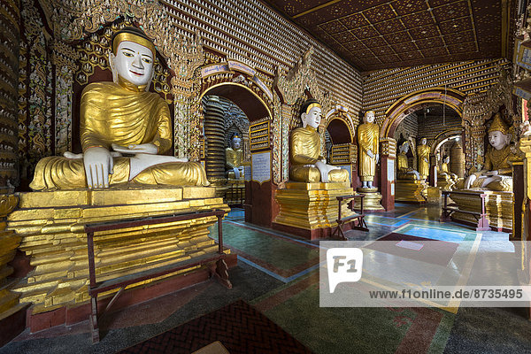 Seated and standing Buddha statues  Mohnyin Thanboddhay or Thanbuddhei Pagoda or Paya  Monywa  Sagaing Division  Myanmar