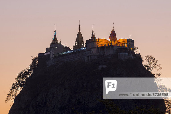 Buddhist nonastery  Tuyin Taung Pagoda on the volcanic cone of Taung Kalat  at sunset  Mount Popa  Mandalay Region  Myanmar