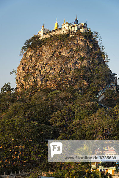 Buddhist monastery gilded Tuyin Taung Pagoda on the Taung Kalat volcanic cone Mount Popa Mandalay Region Myanmar