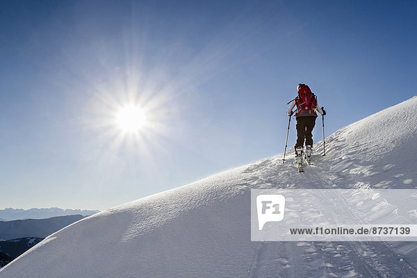 Ski hiker ascending the Seespitz  South Tyrol  Italy