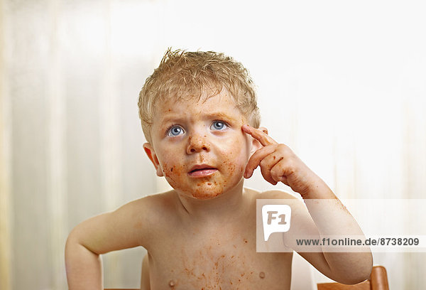 Toddler with a sauce-smeared face