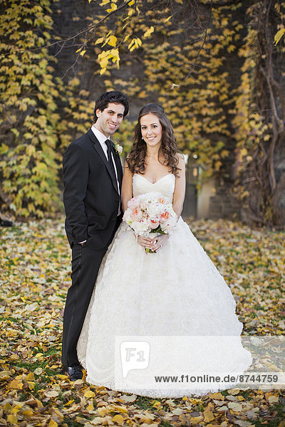 Portrait of Bride and Groom in Autumn  Toronto  Ontario  Canada
