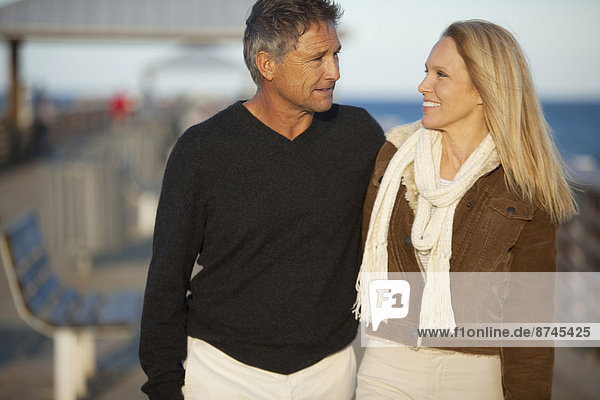 Mature Couple Strolling on Pier  USA