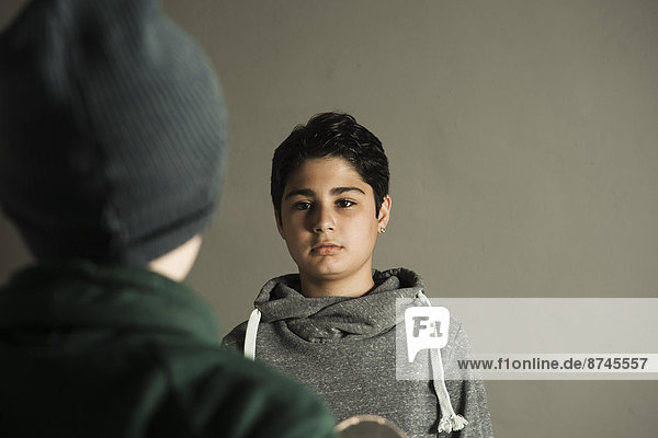 Teenage Boy looking at Boy  Studio Shot