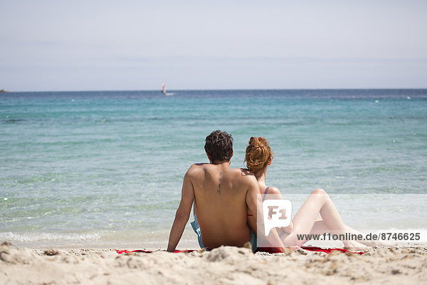 Couple Relaxing at Beach  Sardinia  Italy
