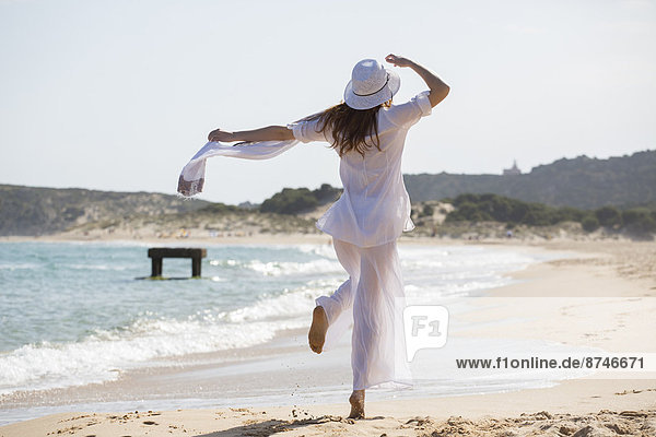 Woman Walking on Beach  Sardinia  Italy