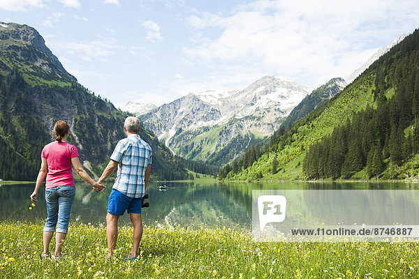 Couple Hiking by Lake  Vilsalpsee  Tannheim Valley  Tyrol  Austria