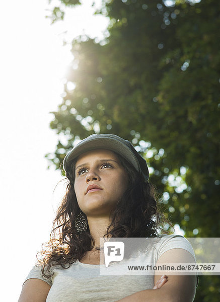 Close-up portrait of teenaged girl wearing cap outdoors  looking into the distance  Germany