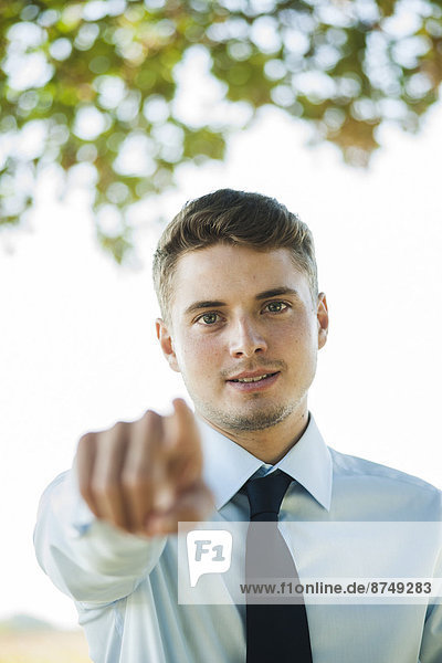 Portrait of Businessman Pointing at Camera  Mannheim  Baden-Wurttemberg  Germany