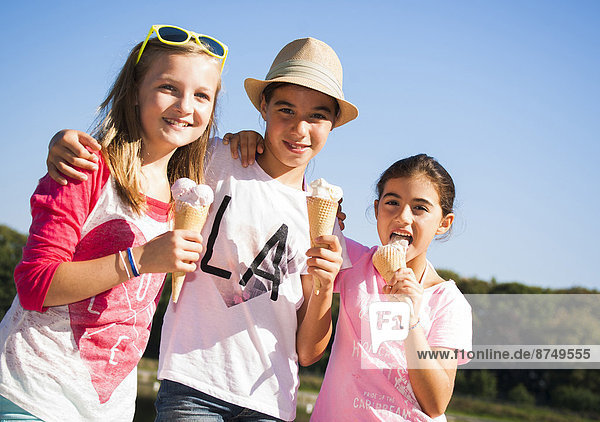 Girls eating Ice Cream Cones  Lampertheim  Hesse  Germany