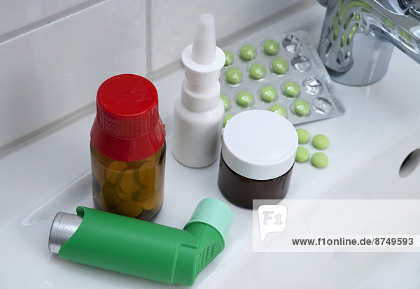 Variety of medications on bathroom sink  studio shot