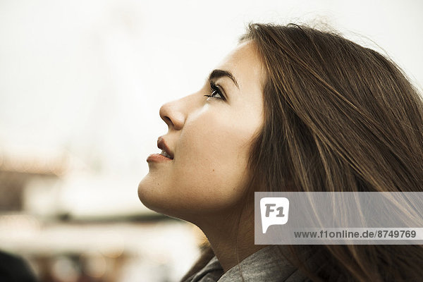 Close-up portrait of teenage girl looking upward  Germany