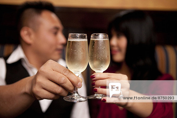 Close-up of couple toasting with champagne glasses  Ontario  Canada