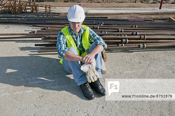 worker taking break in construction site