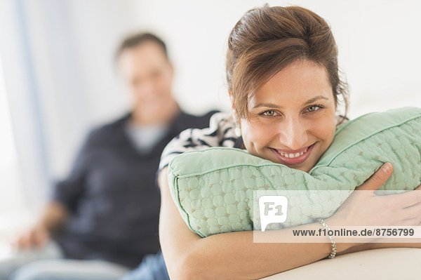 Couple relaxing in sofa  focus on woman