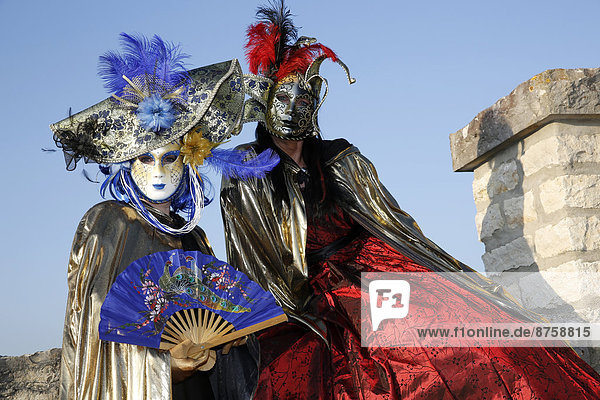 carnival carnival costumes carnival masks costumes daytime dressed up face masks Italy masks outdoors people tradition traditional Two People Venetian Venice women