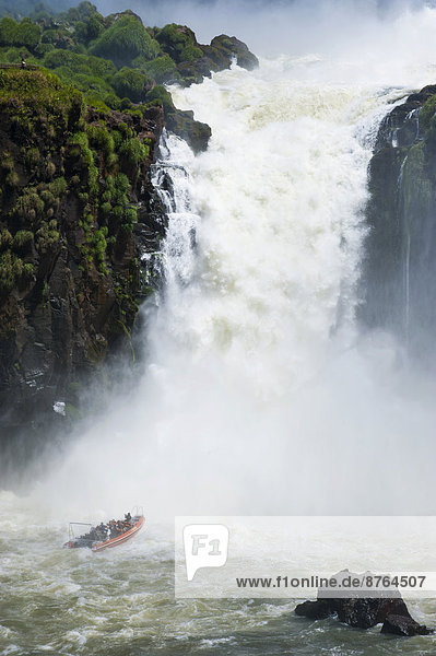 Jetboat underneath the Iguazú Falls  Iguazú National Park  UNESCO World Heritage Site  Argentina