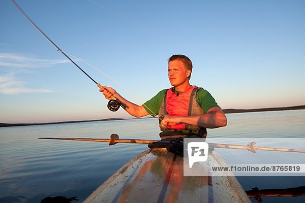 Young man fishing  Sweden