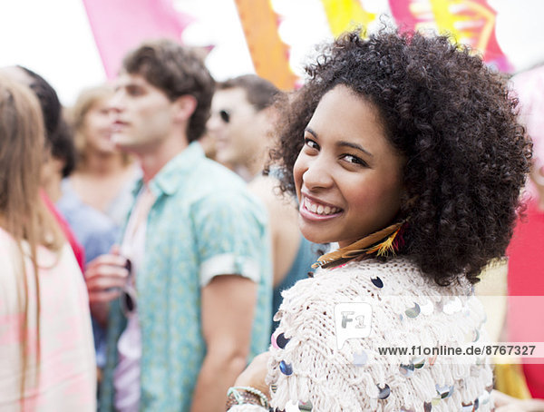 Portrait of smiling woman at music festival
