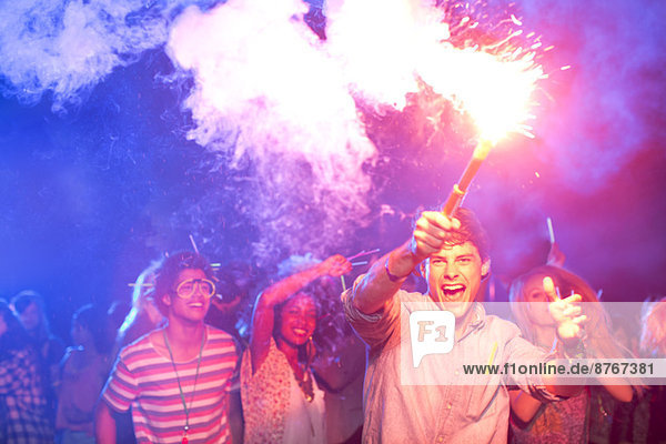 Fans with fireworks at music festival