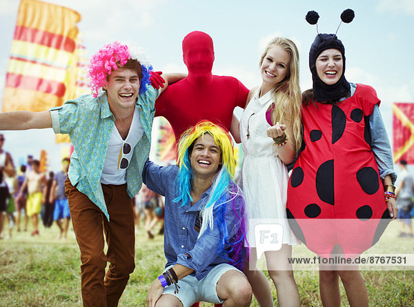 Portrait of friends in costumes at music festival