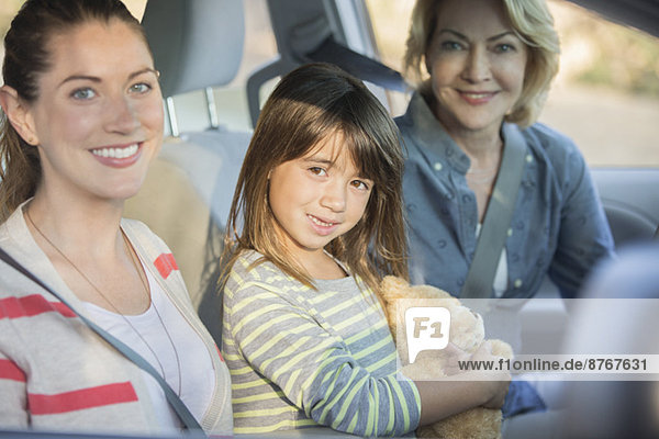 Portrait of multi-generation women inside car