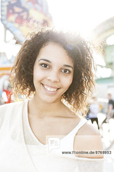 Young woman at fairground  portrait