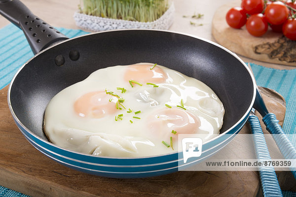 Fried eggs in frying pan
