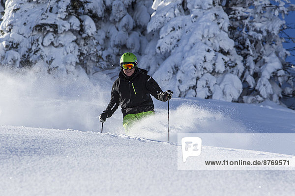 Germany  Bavaria  Sudelfeld  Skier in deep powder snow