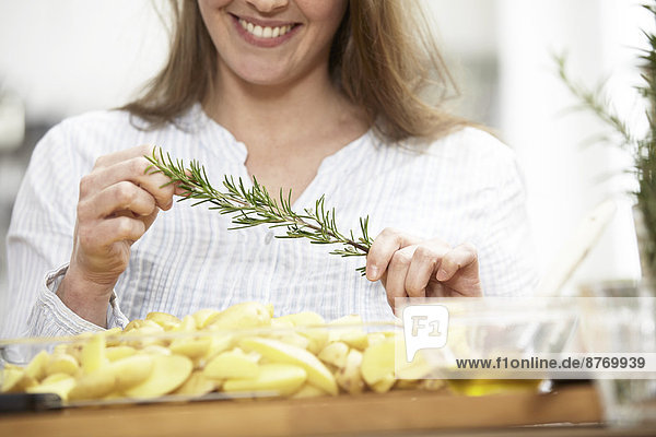Woman preparing potato gratin