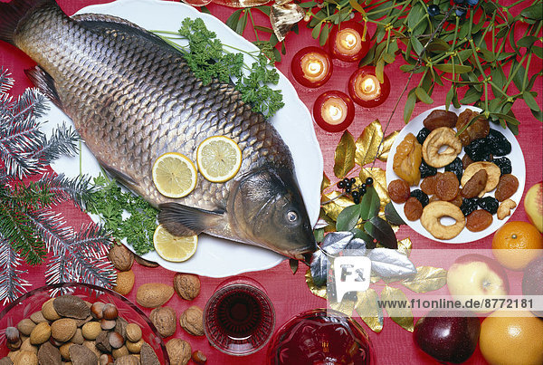 Christmas carp with fruit and nuts  ingredients  Christmas decorations