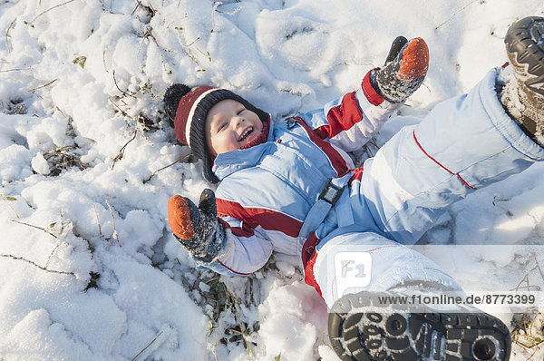 Germany  little boy having fun in snow