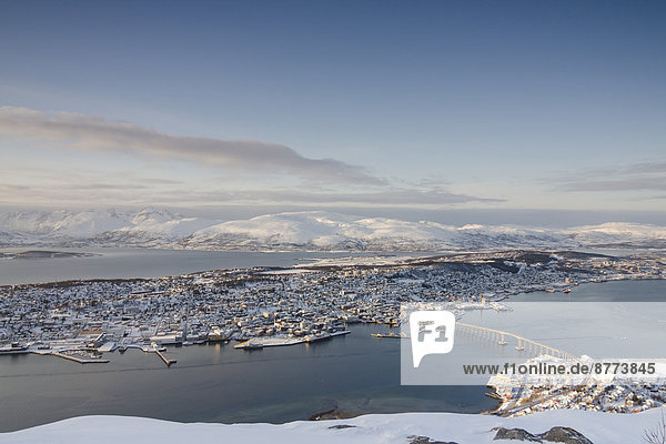 Norway  Troms  Tromso  View from Storsteinen  Cityscape  Tromso Bridge in winter