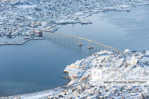 Norway  Troms  Tromso  View from Storsteinen  Cityscape  Tromso Bridge in winter