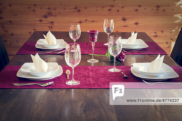 Festive laid table for four persons