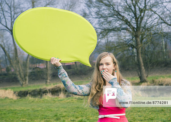Germany  Landshut  Female teenager with green speech bubble