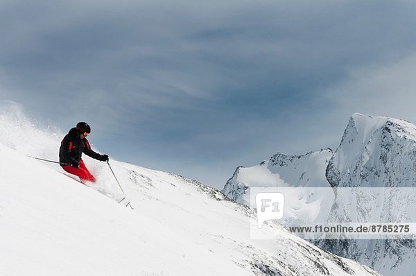 Mid adult male skiing on slope  Obergurgl  Austria
