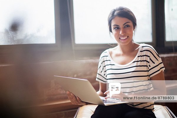 Young woman using laptop computer