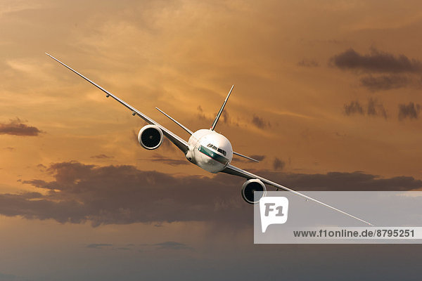 Cathay Pacific Boeing 777-367 ER in flight in the evening light
