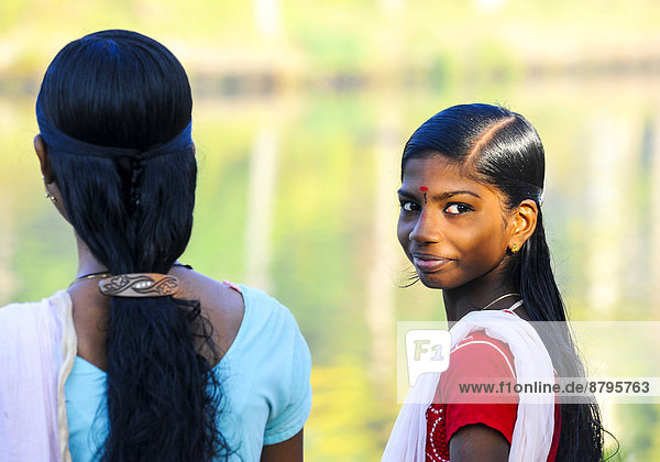 Smiling girl with a bindi  Kerala  South India  India