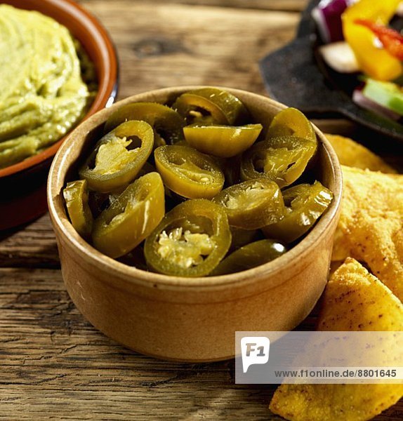 Pickled jalapeños  guacamole and tortilla chips (Mexico)