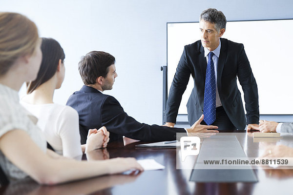 Business associates discuss matter during meeting
